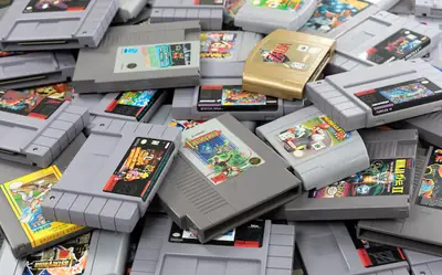 Pile of old retro video game cartridges and discs